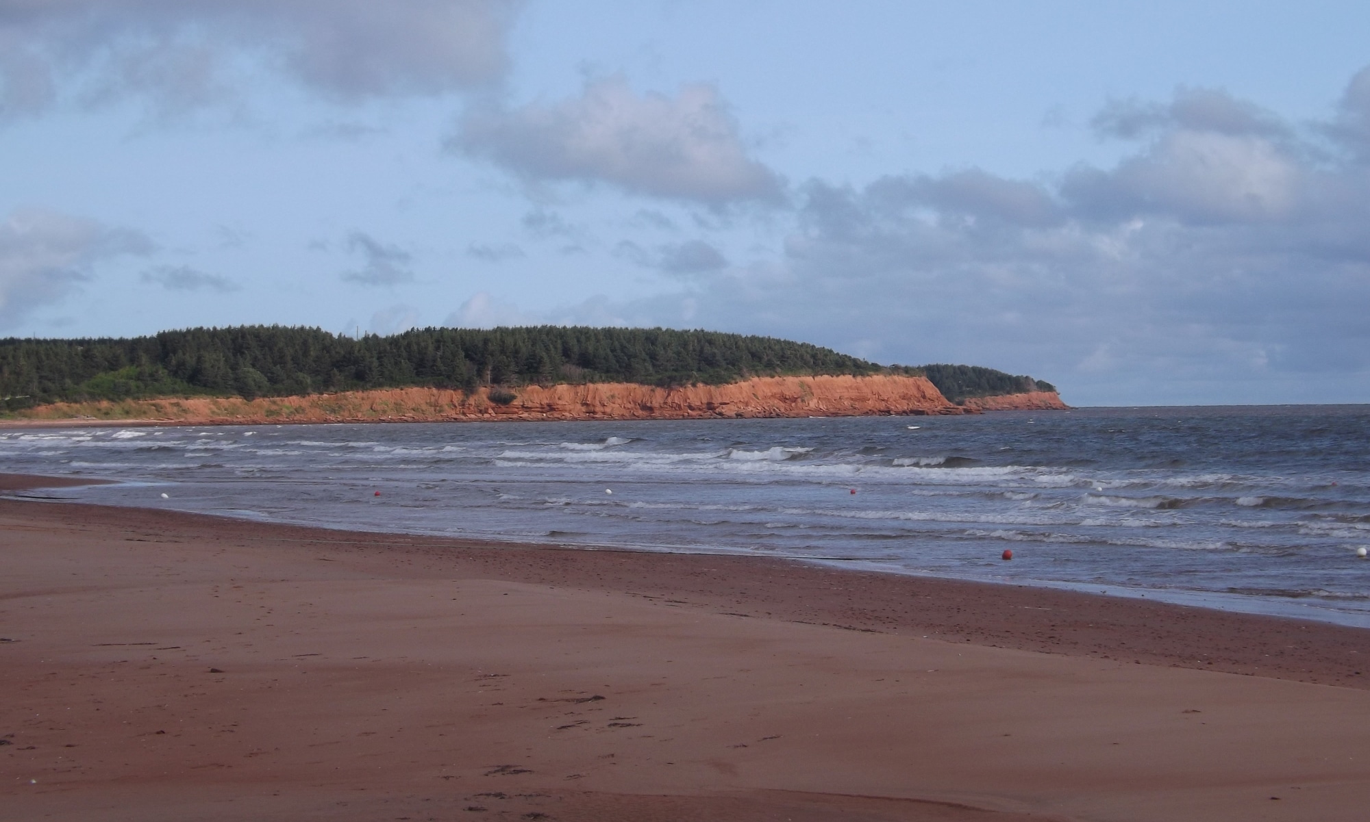 Red sandstone cliffs and beach on PEI north shore